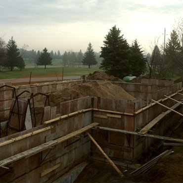 Construction site with basement being assembled